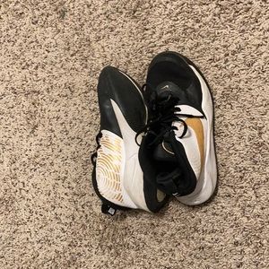 Nike black white and gold shoes